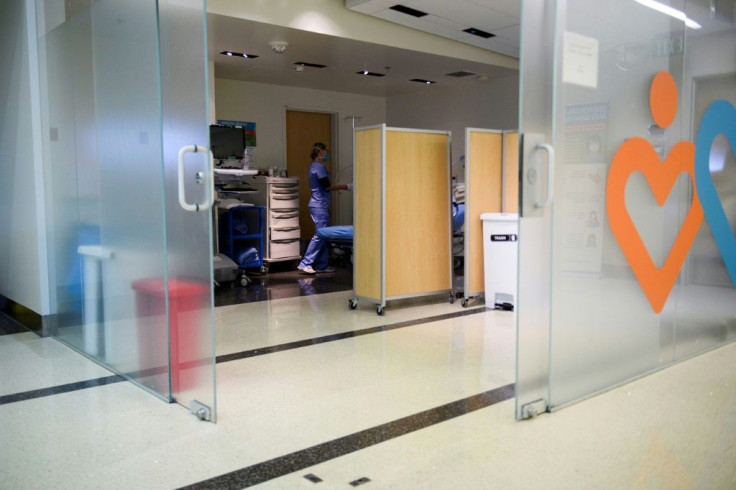 A nurse examines a patient not suspected to have Covid-19 in a former gift shop space converted into a patient examination area at Martin Luther King Jr. Community Hospital on January 6, 2021 in Los Angeles