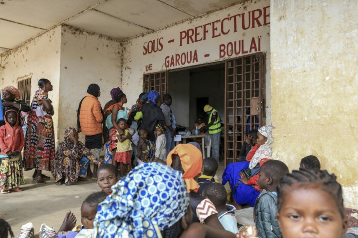 Refugees from the Central African Republic wait in line to register after crossing into Cameroon