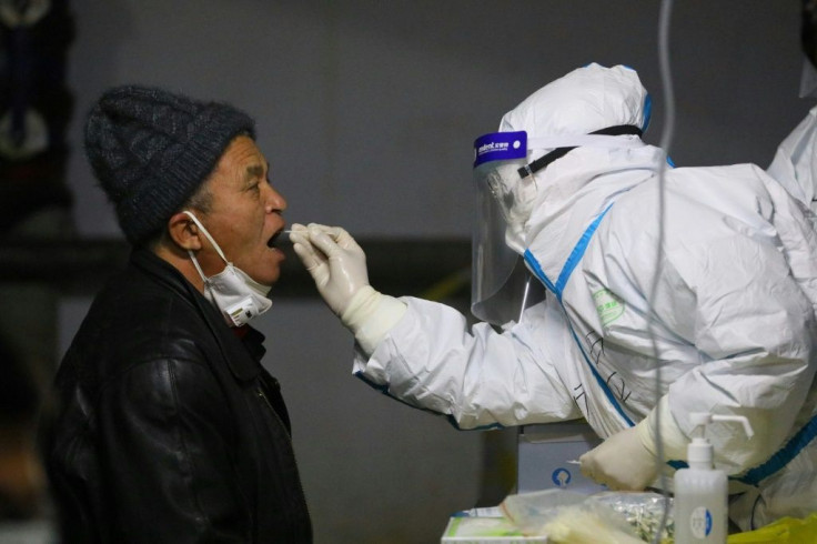 A resident is tested in the Hebei city of Shijiazhuang, epicentre of the latest outbreak