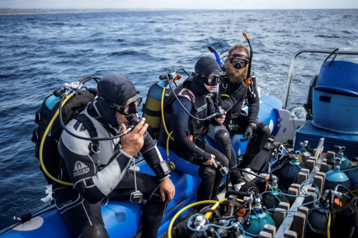 Dive organiser Gary Snodgrass (L) had to change the name of his tours from the 'tiger shark dive' because the species was becoming so rare