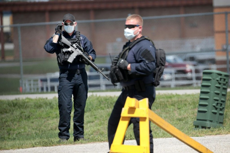 Guards man a road block at the Federal Correctional Complex in Terre Haute, Indiana