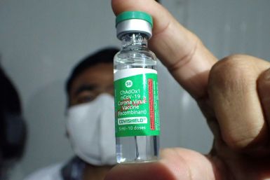 A pharmacist in India shows a vial of the the AstraZeneca coronavirus vaccine, two million doses of which are set for shipment to Brazil by January 16, 2021