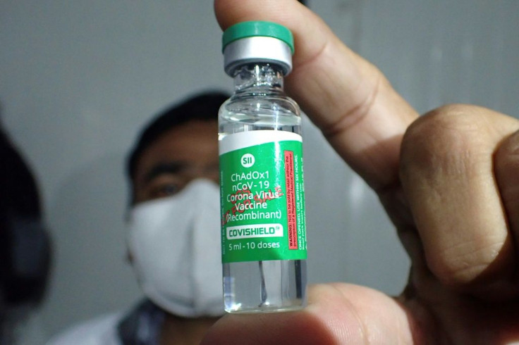 A pharmacist in India shows a vial of the the AstraZeneca coronavirus vaccine, two million doses of which are set for shipment to Brazil by January 16, 2021