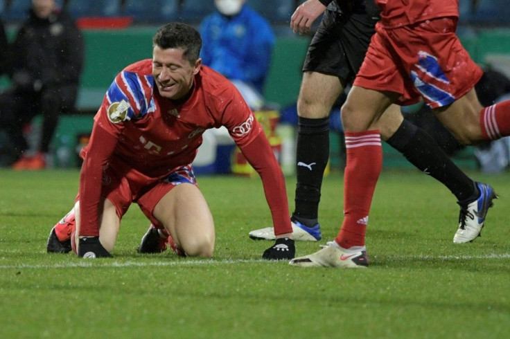 Bayern Munich striker Robert Lewandowski (L) shows his frustration during Wednesday's shock German Cup defeat at Holstein Kiel