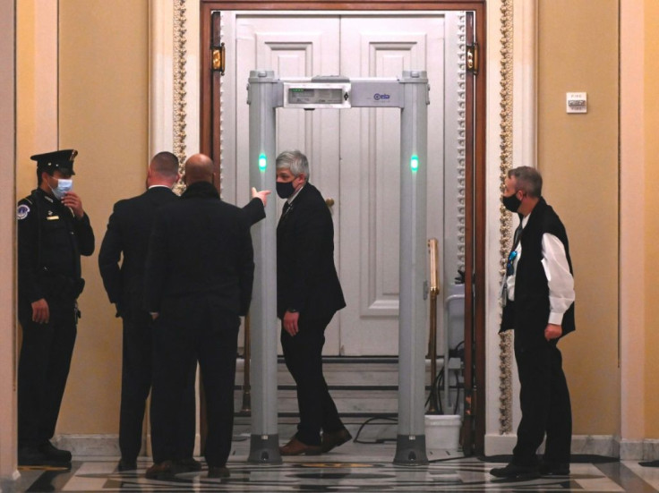 US Capitol Police stand near a metal detector outside chamber of the House of Representatives