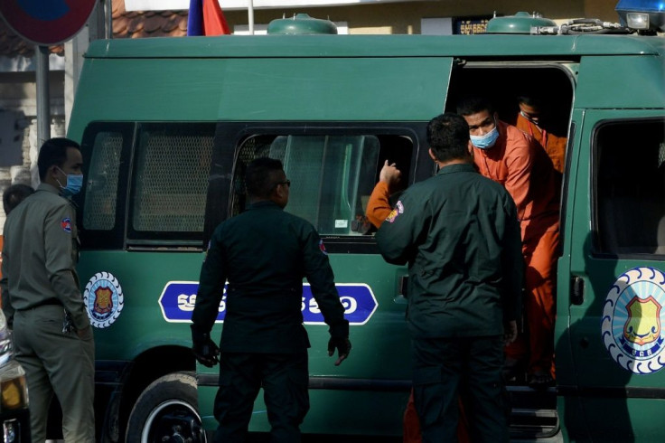 Members of the opposition and activists leave a prison van in front of the Phnom Penh court