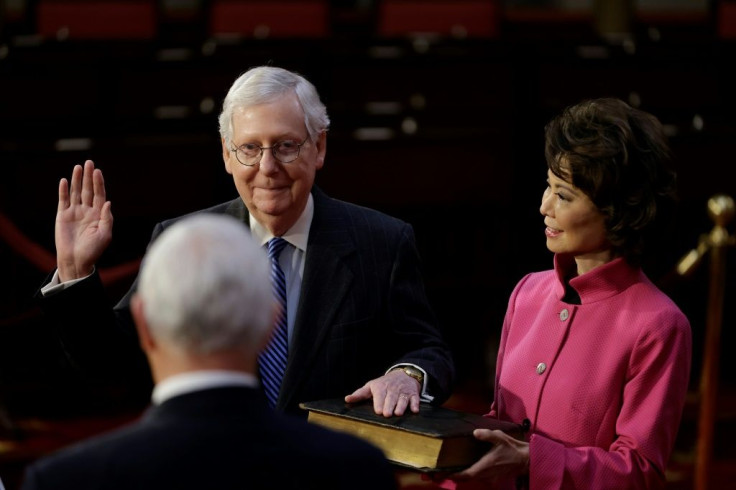 US Senate Majority Leader Mitch McConnell, seen with his wife Elaine Chao, the former secretary of transportation, at a mock swearing in on January 3, 2021 for his seventh term as a US senator