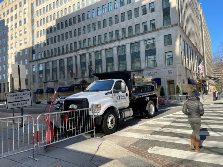 A truck used as a temporary security barrier on a street near the White House