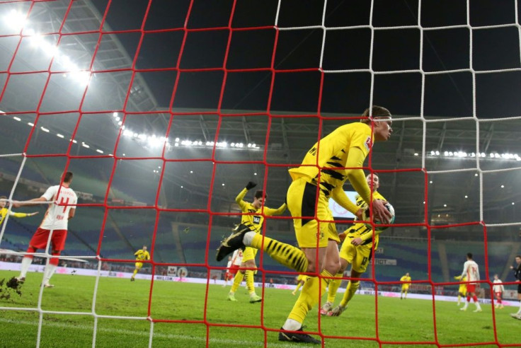 Erling Braut Haaland (C) celebrates scoring his goals for Borussia Dortmund at RB Leipzig last Saturday