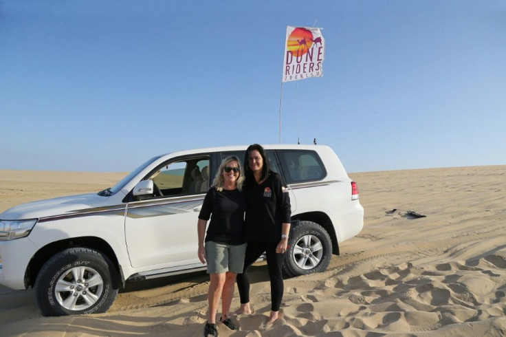 South African Marcelle Visser (L) says she fell in love with the desert "as soon as my tyres touched the sand"