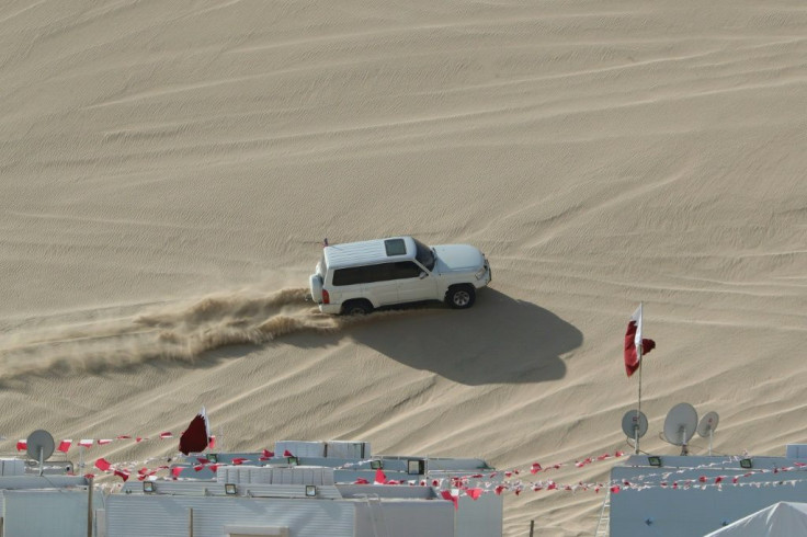 A 4x4 vehicle drives on a dune of Qatar's Sealine desert, around 63 kilometres south of the capital Doha, where off-roading is a hugely popular pastime