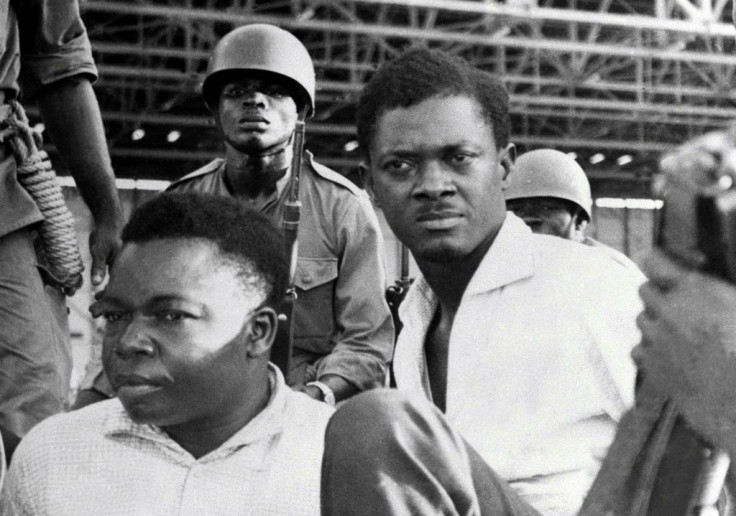 December 1960: Soldiers guard Congo's first post-independence prime minister, Patrice Lumumba, right, after his arrest. To the left is Joseph Okito, vice president of the Senate, who was shot dead alongside Lumumba the following month