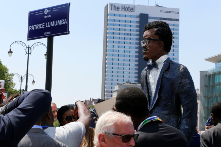 People stand next to a giant effigy of Patrice Lumumba at ceremonies in Brussels in 2018 to inaugurate a square honouring the assassinated independence hero (file picture / Belga)