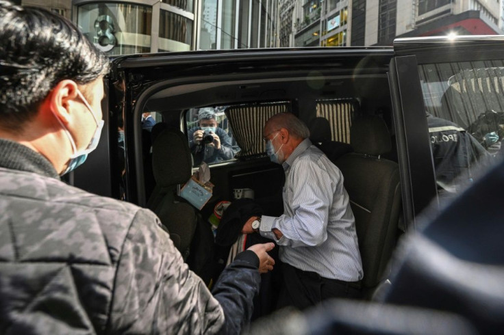 John Clancey, a US lawyer with a Hong Kong law firm known for taking up human rights cases, is led away by police during a major crackdown on January 6, 2020