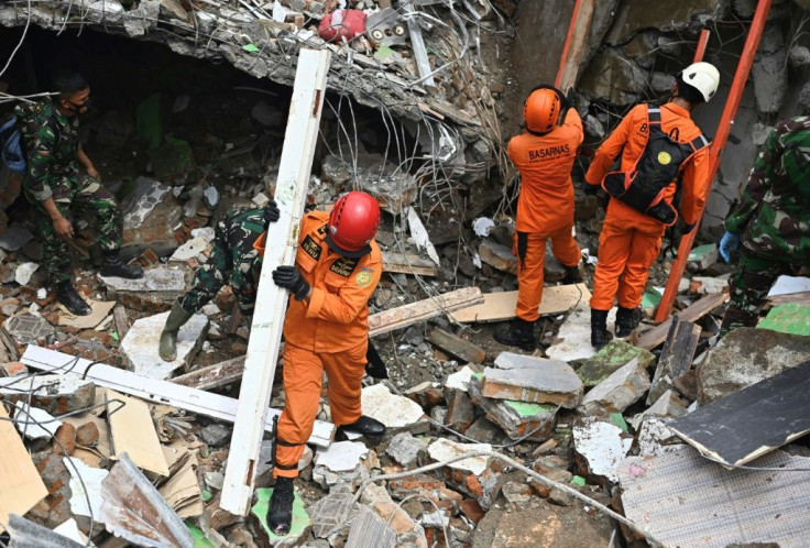 Rescuers searched for survivors at a collapsed building in Mamuju city