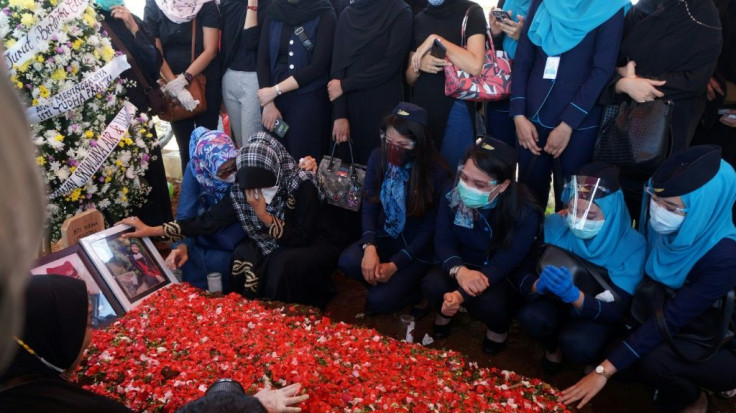 Family members and friends gathered to pray for Sriwijaya Air flight attendant Isti Yudha Prastika, one of the victims of the crash