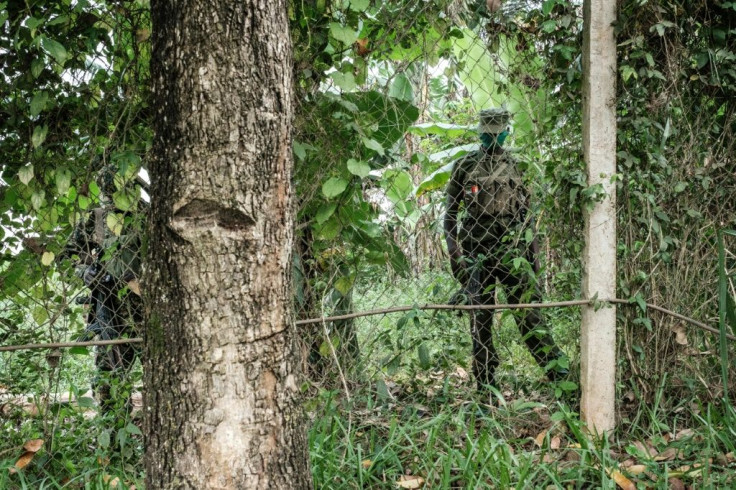 Wine's home remained sealed off by soldiers and police