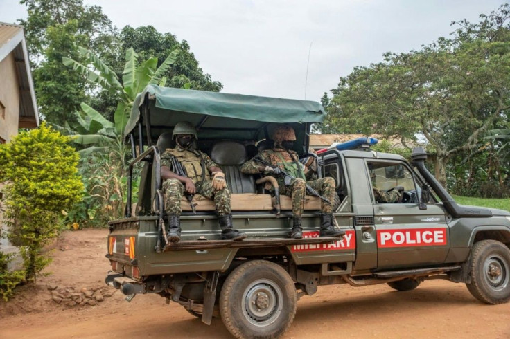 Security forces drive near the house of Presidential candidate Bobi Wine in Magere, Uganda, on Saturday.