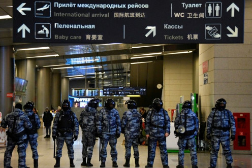 Dozens of police deployed at Vnukovo airport ahead of Navalny's scheduled arrival