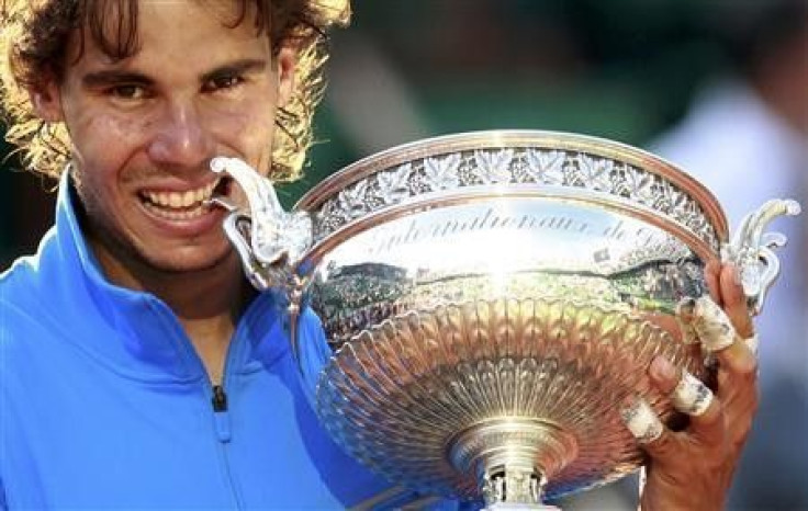 Nadal does his trademark celebration after winning the French Open against Federer on Sunday.