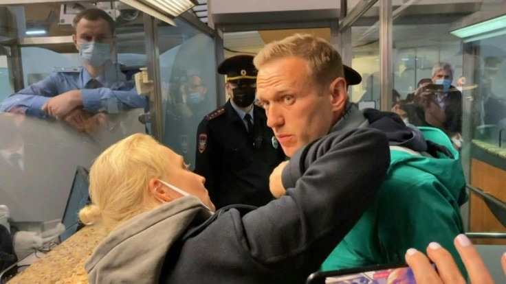 IMAGES Kremlin critic Alexei Navalny is detained at a Moscow airport shortly after he lands on a flight from Berlin.