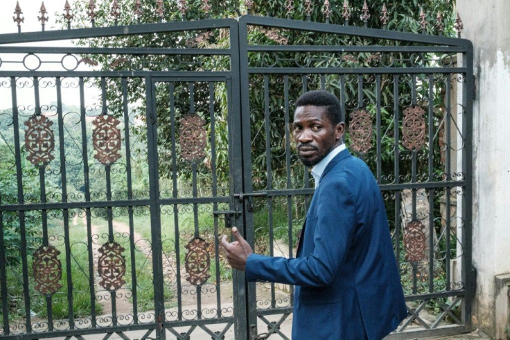 Uganda presidential candidate Bobi Wine shows how security forces jumped his fence after Thursday's election