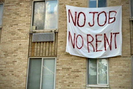 A banner protests eviction on a building in Washington