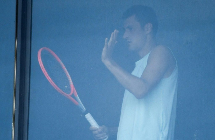 Bernard Tomic exercises in his hotel room in Melbourne. "I don't mind Bernie but his Mrs obviously has no perspective, ridiculous scenes," Kyrgios said of his fellow Australian player