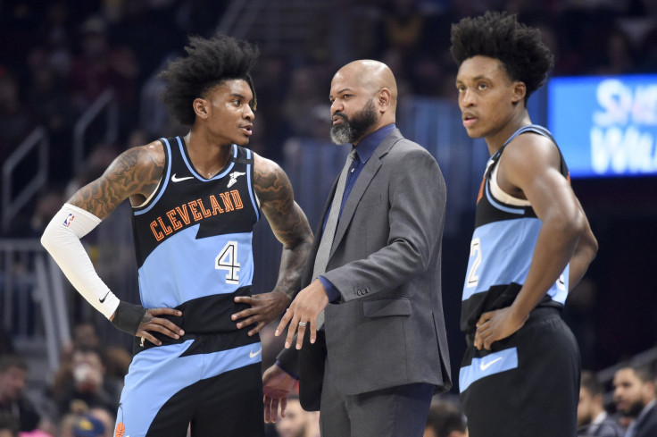 Head coach J.B. Bickerstaff of the Cleveland Cavaliers speaks to Kevin Porter Jr. #4 and Collin Sexton #2 during the first half at Rocket Mortgage Fieldhouse