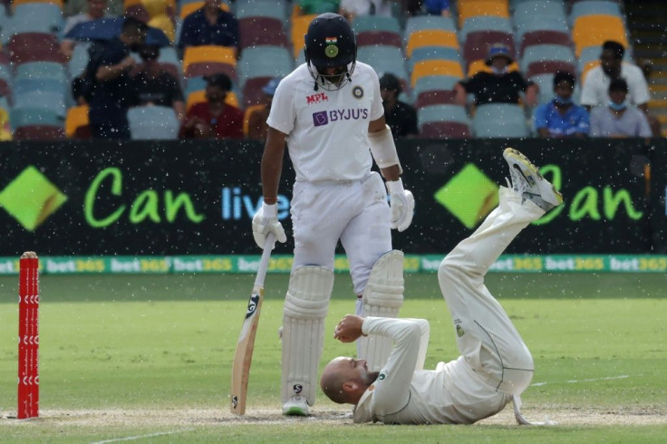 Cheteshwar Pujara (L) played a key innings, while Australia's Nathan Lyon (R) was left stranded on 399 Test wickets