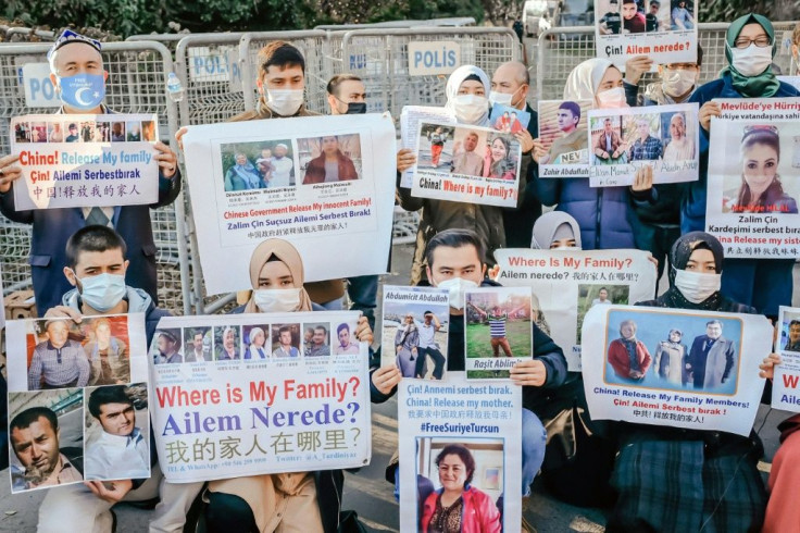 Members of the Muslim Uighur community hold placards as they demonstrate in December 2020 in front of the Chinese consulate in Istanbul, which has become a major center for Uighur exiles