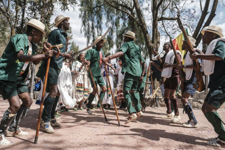 As rifle-toting actors danced around chanting actresses, an audience cheered when the troupe denounced the Tigray People's Liberation Front as a band of 'traitors'Â 