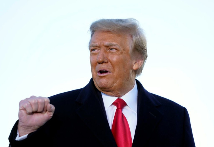 US President Donald Trump speaks before boarding Air Force One at Joint Base Andrews in Maryland on January 20, 2021. President Trump travels to his Mar-a-Lago golf club residence in Palm Beach, Florida, and will not attend the inauguration for President-