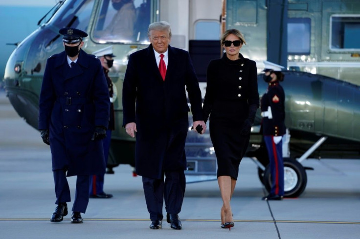 Outgoing US President Donald Trump and First Lady Melania Trump walk from Marine One at Joint Base Andrews in Maryland on January 20, 2021