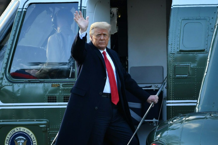 US President Donald Trump waves as he boards Marine One to depart the White House for the final time on January 20, 2021