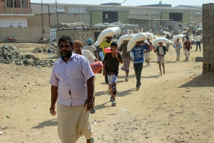 Displaced Yemenis receive humanitarian aid provided by the World Food Programme (WFP) in the northern province of Hajjah