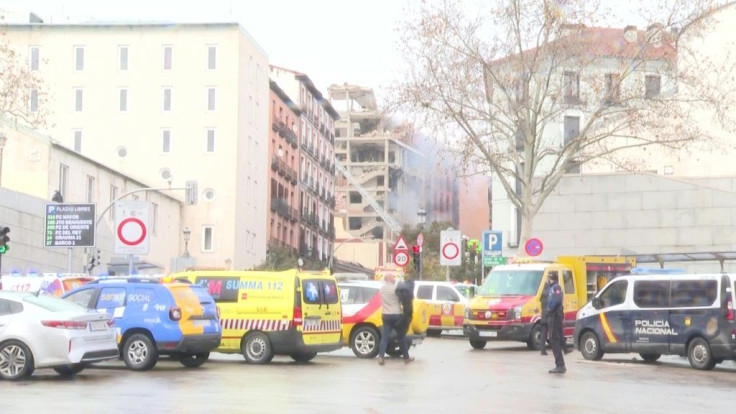 Madrid emergency services rush to the site of a strong explosion in Madrid that has killed at least two people