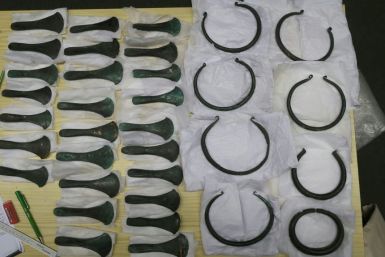 This undated handout photo obtained January 20, 2021 shows Bronze age axe heads and rings from the Carsdorf Hoard, taken at the Natural History Museum, Leipzig, Germany