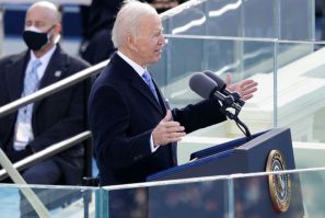 Joe Biden speaks at his inauguration as president, saying 'America has been tested anew, and America has risen to the challenge.'