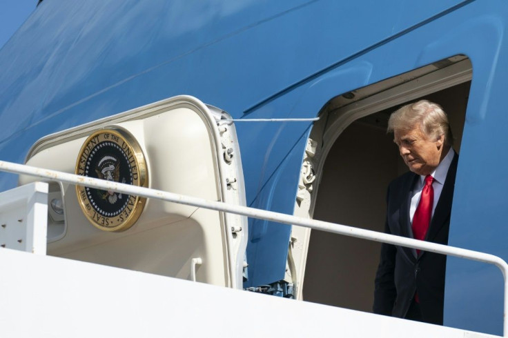 Outgoing US President Donald Trump exits Air Force One as they arrive at Palm Beach