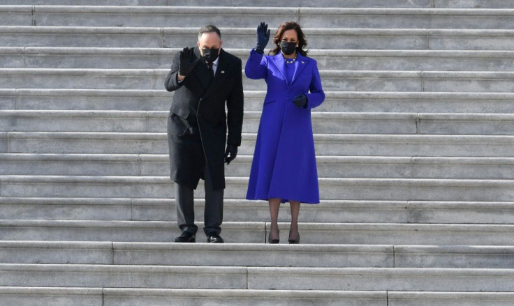 Vice President Kamala Harris and her husband US Second Gentleman Doug Emhoff wave as former US Vice President Mike Pence and his wife Karen Pence leave after the inauguration of Joe Biden as the 46th US President January 20, 2021, at the US Capitol
