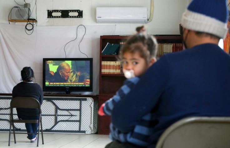 Central American migrants watch Joe Biden's inauguration at a shelter in Ciudad Juarez in northern Mexico