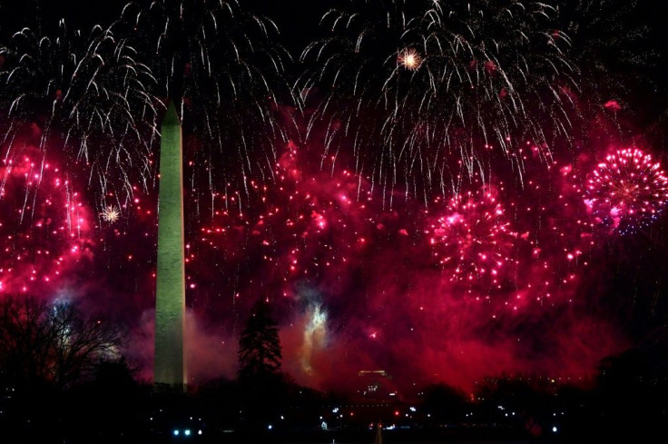 Fireworks explode behind the Washington Monument to fete Joe Biden's inauguration as president of the United States