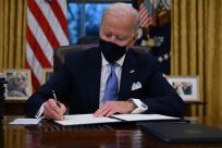 President Joe Biden signing executive orders soon after his inauguration on Wednesday