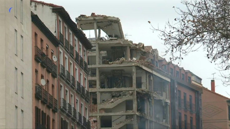 Locals and witnesses react after a huge explosion killed at least three people in Madrid, with officials confirming it was caused by a gas leak.