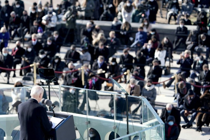 US President Joe Biden bows his head in prayer to honor those lost due Covid-19 as he gives his inaugural address during the 59th Presidential Inaguration ceremony on January 20, 2021, at the US Capitol in Washington, DC