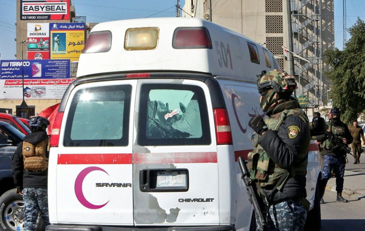 Iraqi security forces at the scene of Thursday's twin suicide bombing