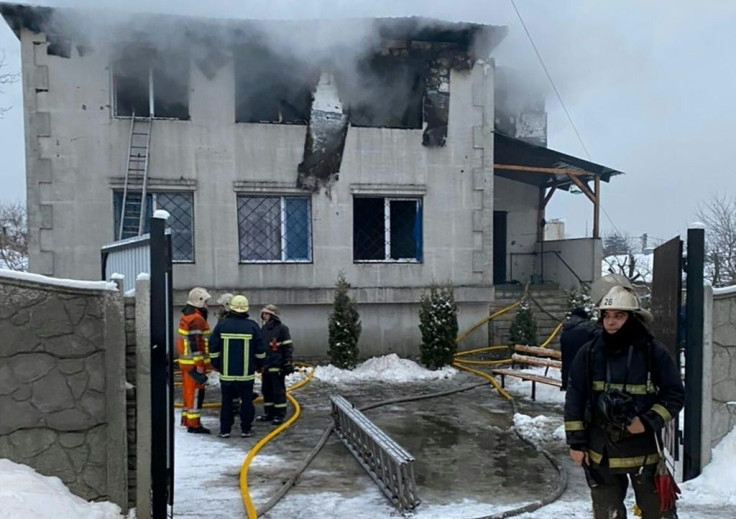 Firefighters work at the site of a fire in a nursing home in Kharkiv on January 21, 2021.