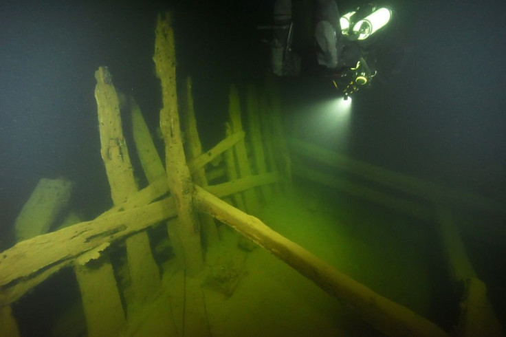 Archaeologists from Sweden's National Maritime and Transport Museums carry out a dive on the wreck of a 16th century merchant ship off the coast of Dalaro in the Stockholm Archipelago in 2017