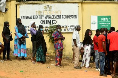 Nigerians queue to obtain the precious National Identity Number -- without it, their mobile phone may be cut off